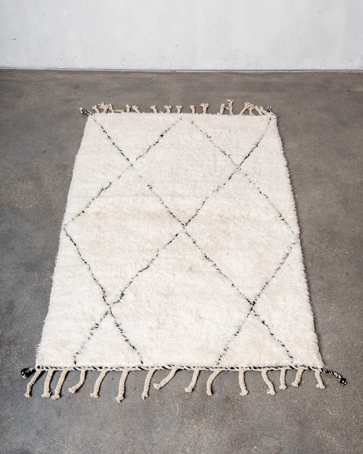 Modern, designer, handcrafted Berber rug from Morocco. Beniourain carpet with minimalist design, natural wool pile and a fluffy texture.